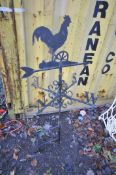 A BLACK PAINTED WROUGHT IRON WALL MOUNTED ROOSTER WEATHER VANE, height 124cm (condition:-partially