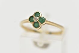 A 9CT YELLOW GOLD DIAMOND AND EMERALD CLUSTER RING, set with a round brilliant cut diamond