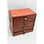 A WOODEN TABLE TOP CHEST, a six drawer stationary cabinet, fitted with two side handles, approximate