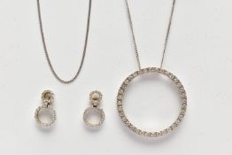 A 9CT WHITE GOLD DIAMOND PENDANT NECKLACE AND MATCHING EARRINGS, the pendant of an openwork circular