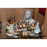 A GROUP OF HUMMEL FIGURINES, POOLE POTTERY AND A ROYAL DOULTON FIGURINE, comprising nine Hummel