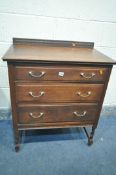 A 20TH OAK CHEST OF THREE LONG DRAWERS, with a raised back, on barley twist supports, united by