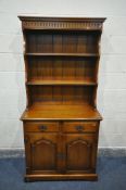 A ROYAL OAK FURNITURE COMPANY, BALMORAL COLLECCTION, A PERIOD STYLE OAK DRESSER, with two shelves,