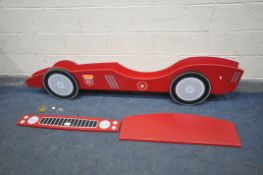 A RACING CAR CHILDRENS BED frame with slats, condition:- appears to have all bolts)