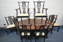 A VICTORIAN MAHOGANY WIND OUT DINING TABLE, on cabriole legs with floral decoration to legs and ball