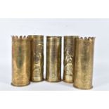 FIVE WWI ERA TRENCH ART SHELL CASES, to include two that have been hand beaten with a flower type