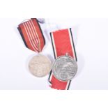 A NSDAP BLOOD ORDER MEDAL AND A 1936 OLYMPIC MEDAL, the blood order is officially known as the