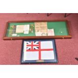 A LARGE DISPLAY CASE CONTAINING WWI AND WWII MEDALS, also included is a framed replica flag, the
