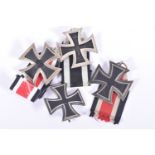 FOUR GERMAN IRON CROSSES, to include a WWI first class iron cross, a 2nd class WWI iron cross and