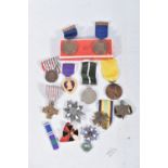 A MIXED PARCEL OF MEDALS FROM VARIOUS COUNTRIES to include an unnamed Purple Heart, an Order Of