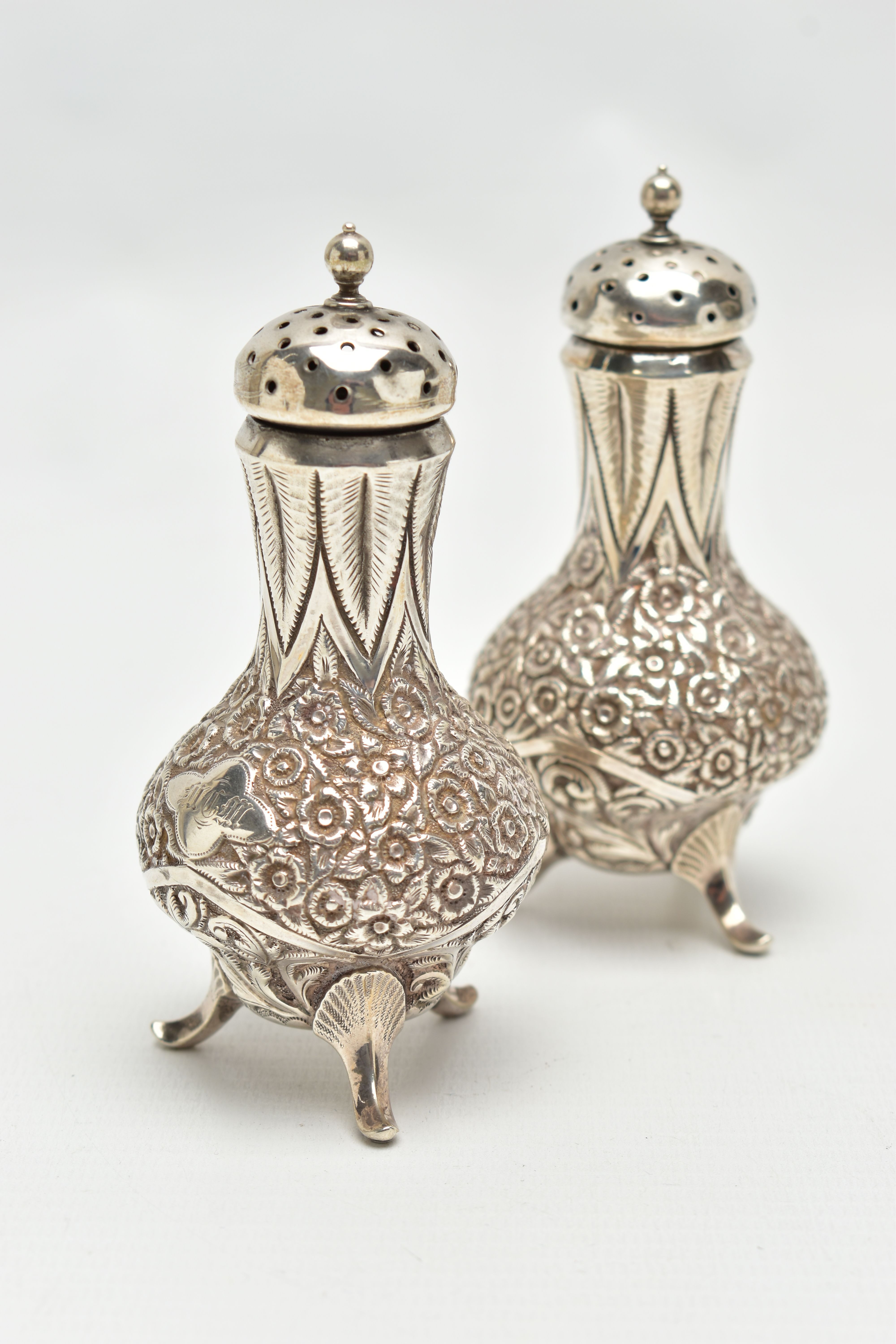 A PAIR OF WHITE METAL PEPPERETTES, baluster form, decorated with a floral and foliate pattern, - Image 2 of 4