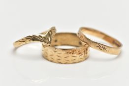 THREE 9CT YELLOW GOLD RINGS, to include a wide band with engraved detail, a wish bone ring and a