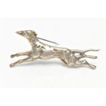 A GREYHOUND BROOCH, in running pose, stamped sterling silver, length 70mm, approximate gross