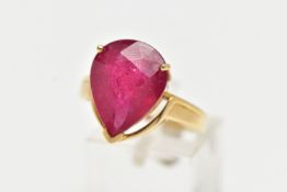 A 18CT GOLD GEM SET RING, a large pear cut glass filled ruby, approximate stone dimensions length