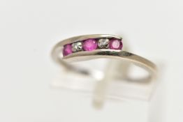 A 9CT WHITE GOLD CROSS OVER RING, set with three circular cut rubies, interspaced with two single