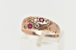 A 9CT GOLD EDWARDIAN RING, four single cut diamonds and two circular cut rubies set within a rose