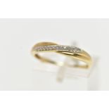 A 9CT YELLOW GOLD DIAMOND HALF ETERNITY RING, cross over style set with a row of single cut