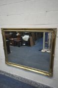 A GILT FRAMED BEVELLED EDGE WALL MIRROR, 131cm x 103cm (condition:-some gilt slightly peeling)