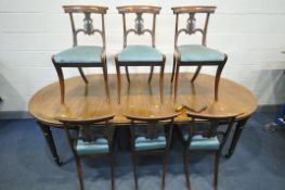 A REGENCY MAHOGANY WIND OUT DINING TABLE, with rounded ends, two additional leaves, on reeded