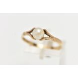 A 9CT YELLOW GOLD CULTURED PEARL RING, centering on a single tension set, cultured white pearl