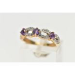 A 9CT YELLOW GOLD, AMETHYST AND DIAMOND RING, designed with three claw set, circular cut