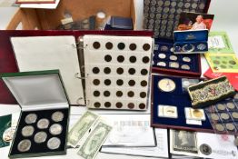 A LARGE BOX OF WORLD COINAGE, to include a distressed boxed Haiti three coin set of .999 silver
