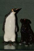 TWO WINSTANLEY CREATURES, comprising an Emperor Penguin size 6, height 27.5cm and a Black Labrador