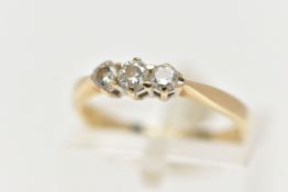 A THREE STONE DIAMOND RING, three round brilliant cut diamonds prong set in yellow gold, approximate