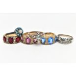 A SELECTION OF SEVEN RINGS, to include a white metal eternity ring, grain set with circular cut