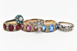 A SELECTION OF SEVEN RINGS, to include a white metal eternity ring, grain set with circular cut
