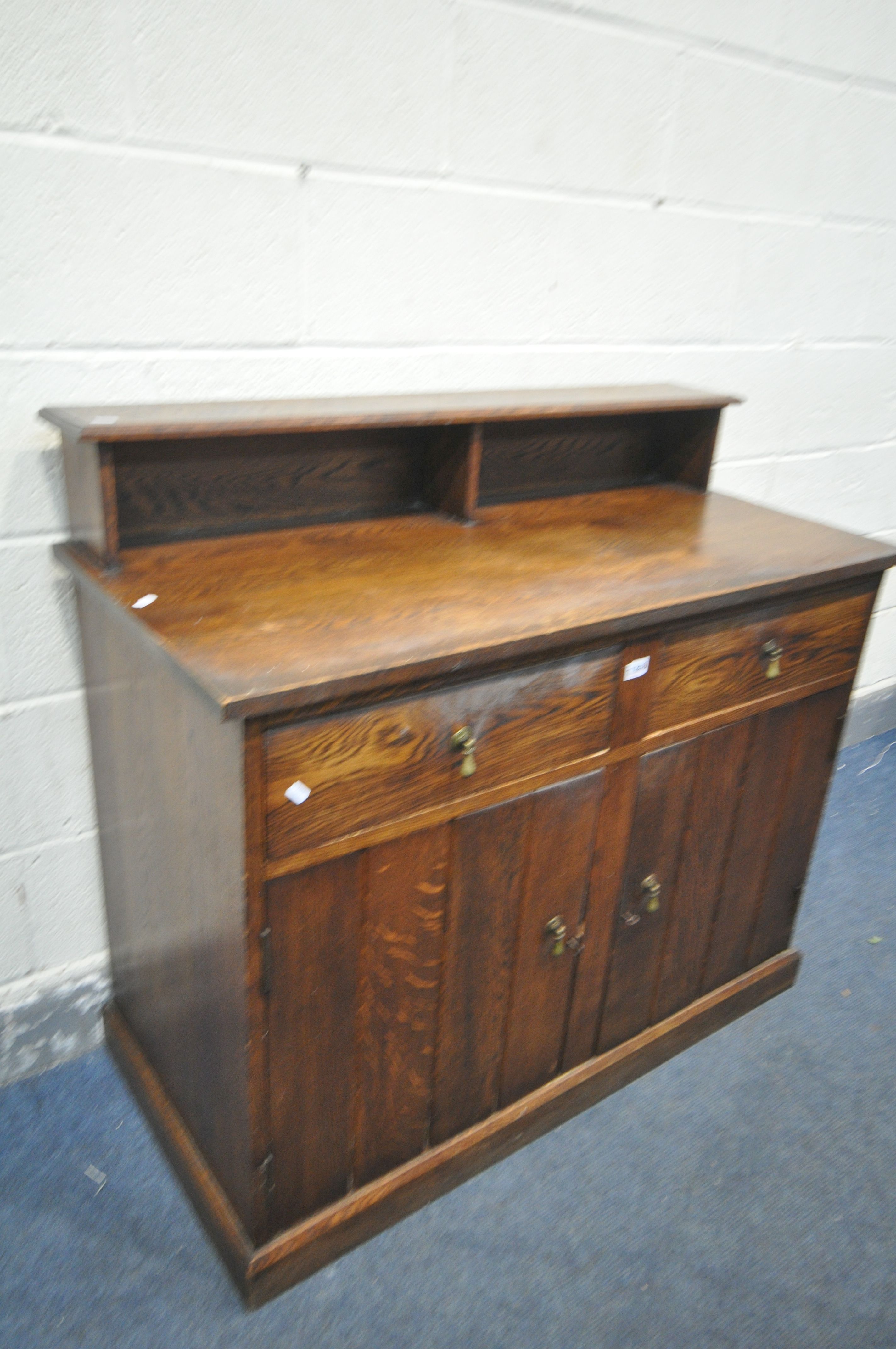AN OAK SIDEBOARD, with a raised back, two drawers, over double cupboard doors, width 112cm x depth - Image 2 of 2