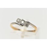 A THREE STONE DIAMOND RING, a central round brilliant cut with two single cut diamonds either