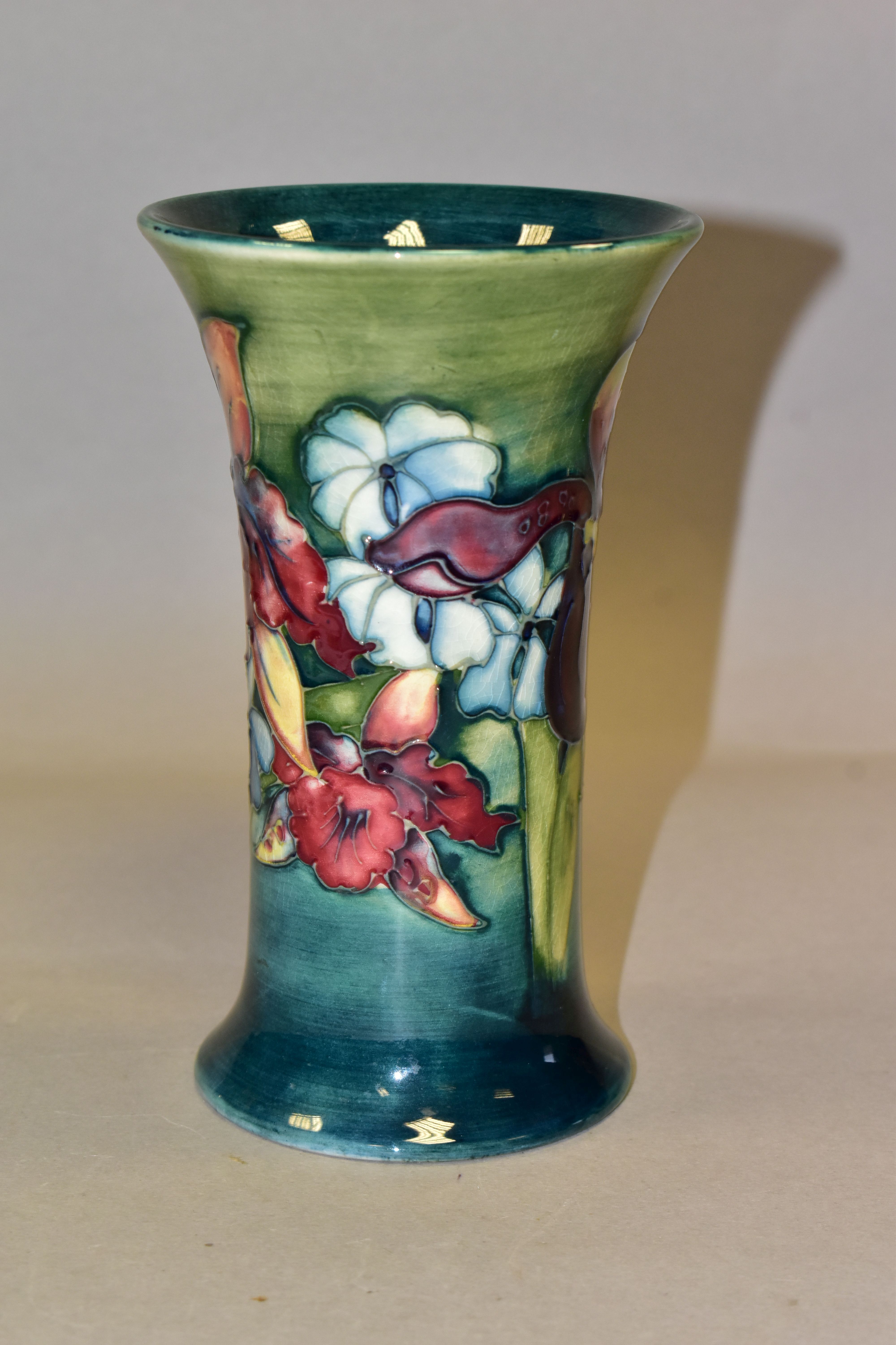 A MOORCROFT POTTERY 'ORCHID' PATTERN VASE, of cylindrical tapering form, tube lined with purple - Image 2 of 4