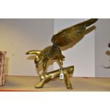 A LARGE, HEAVY BRASS EAGLE PERCHED ON A BRANCH, wings spread, height 44cm to tip of wing (1) (