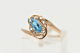 A TOPAZ AND DIAMOND DRESS RING, a marquise cut topaz accented with four round brilliant diamonds,