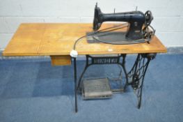 A VINTAGE ELECTRIC SINGER TREADLE SEWING MACHINE, serial number 31k15 (condition:-PAT pass and