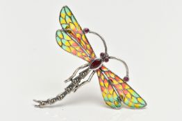 A WHITE METAL PLIQUE A JOUR BROOCH/PENDANT, in the form of a dragonfly, set with ruby eyes and