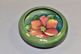 A MOORCROFT POTTERY 'CLEMATIS' PATTERN BOWL, with rolled rim, tube lined with pink and peach