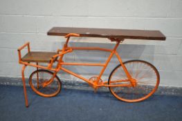 A CONTEMPORY BESPOKE SIDE TABLE, made from a vintage bicycle, painted in orange, forming of two