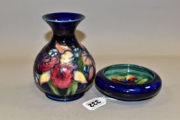 A MOORCROFT POTTERY 'ORCHID' PATTERN VASE AND BOWL, each tube lined with purple and pale yellow