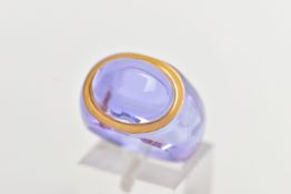 A BOXED 'BACCARAT' RING, purple domed glass ring, within a gold tone rim, ring size centre I 1/2,