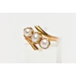 A CULTURED PEARL RING, three cultured white pearls with a silver hue, prong set in a twisted mount