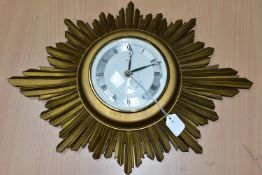 A TEMPORA SUNBURST CLOCK, battery powered quartz, width 42cm x height 30cm x diameter