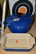 A BLUE LE CREUSET ENAMELLED CAST IRON OVEN POT, with lid and box, together with a small blue Le