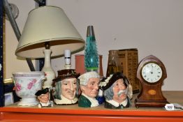 A GROUP OF CHARACTER JUGS AND TABLE LAMPS, to include an Edwardian keyhole shaped mantle clock