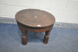A HARDWOOD CIRCULAR OCCASIONAL TABLE, with studded design to top, turned legs, united by shaped