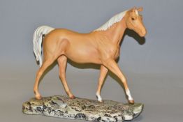 A ROYAL DOULTON 'SUNBURST' FIGURE of a Palomino horse, similar to Beswick model no 2671, in a matt