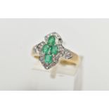 A 9CT YELLOW GOLD, EMERALD AND DIAMOND DRESS RING, of a marquise form, centrally set with four, claw