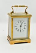 A BRASS CARRIAGE CLOCK, rectangular form, white dial, Roman numerals, four glass viewing panels to