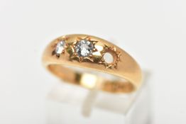 A 18CT GOLD THREE STONE GYPSY RING, a AF yellow gold ring centrally set with a single old cut